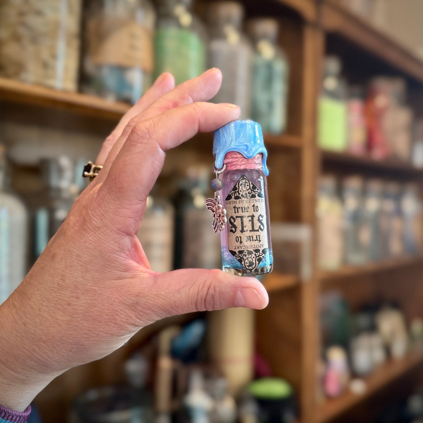 True to Self, A Pink to Blue Color Change Mini Potion Bottle Fidget
